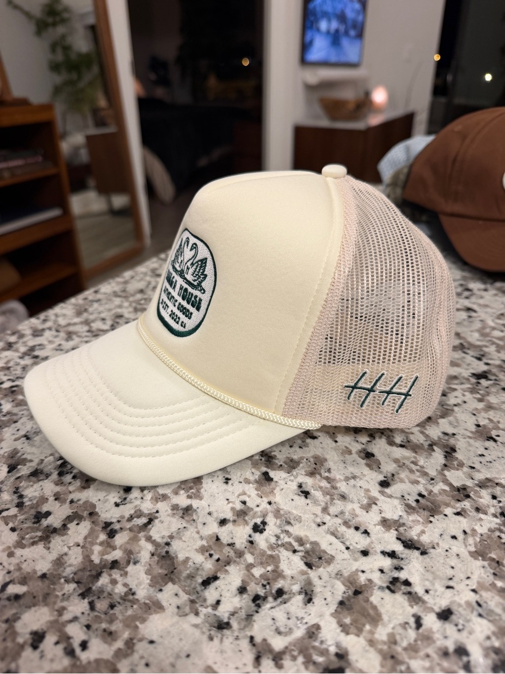 Huega House Cream Trucker Cap with Green Patch and Stitching